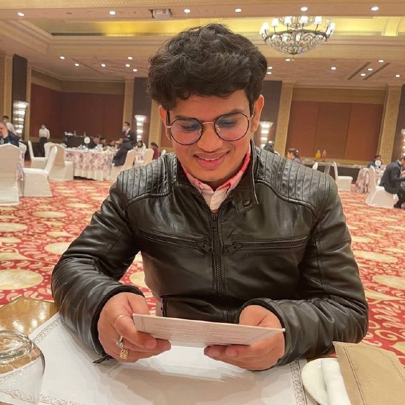 Shakti Tiwari — at a formal event, leather jacket
