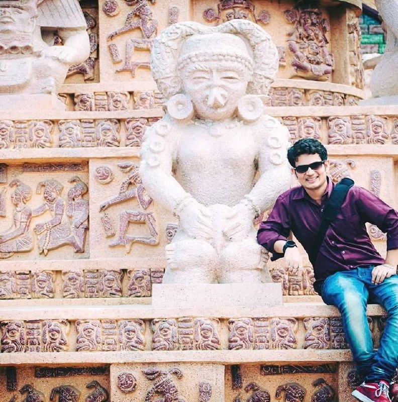 Shakti Tiwari — at a historical temple, purple shirt